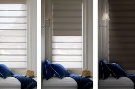 Three images show a window with striped shades in varying positions, demonstrating how to get total blackout in your home. From open to partially closed to fully closed, each image captures the changing ambiance, complemented by a blue-cushioned bench in front.