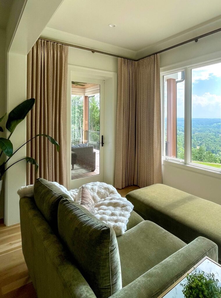 Neutral custom drapery framing a French door and mountain view in a Chattanooga sitting room