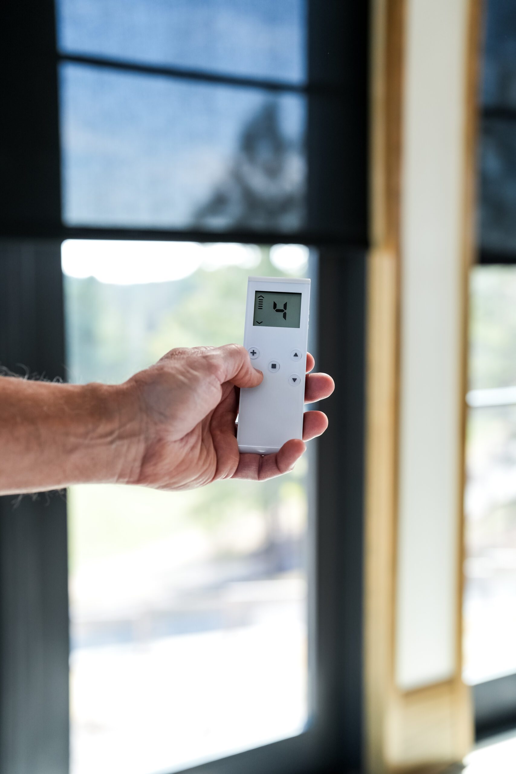 Remote control for motorized window treatments and smart shades in a Chattanooga home